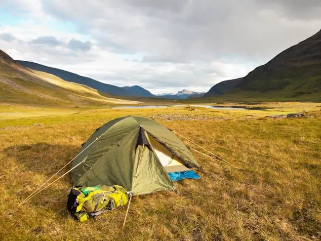 A backpacking tent is small, lightweight and is designed to be carried long distances.